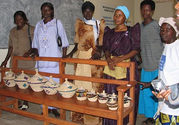 Women entrepreneurs at The Hunger Project-Uganda's Iganga epicenter in 2008 with their hand-crafted baskets. 